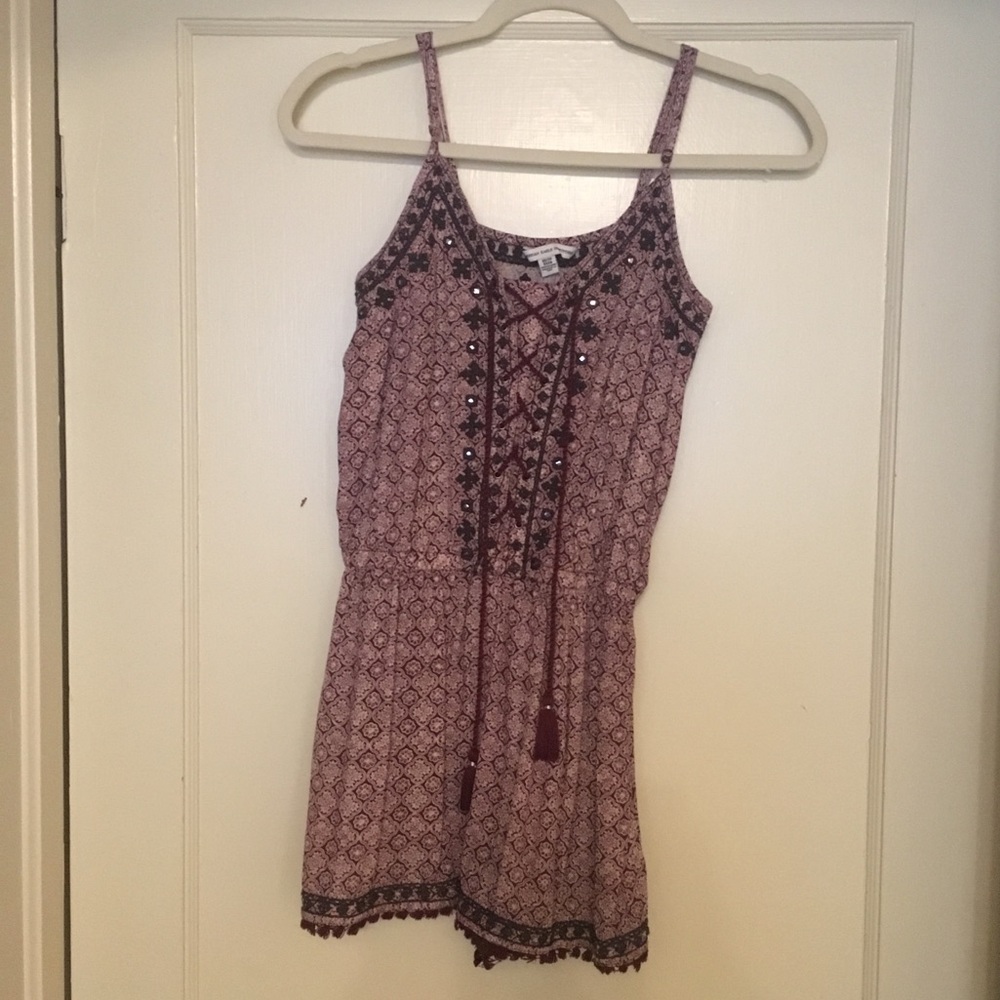 Maroon, black, and white patterned romper